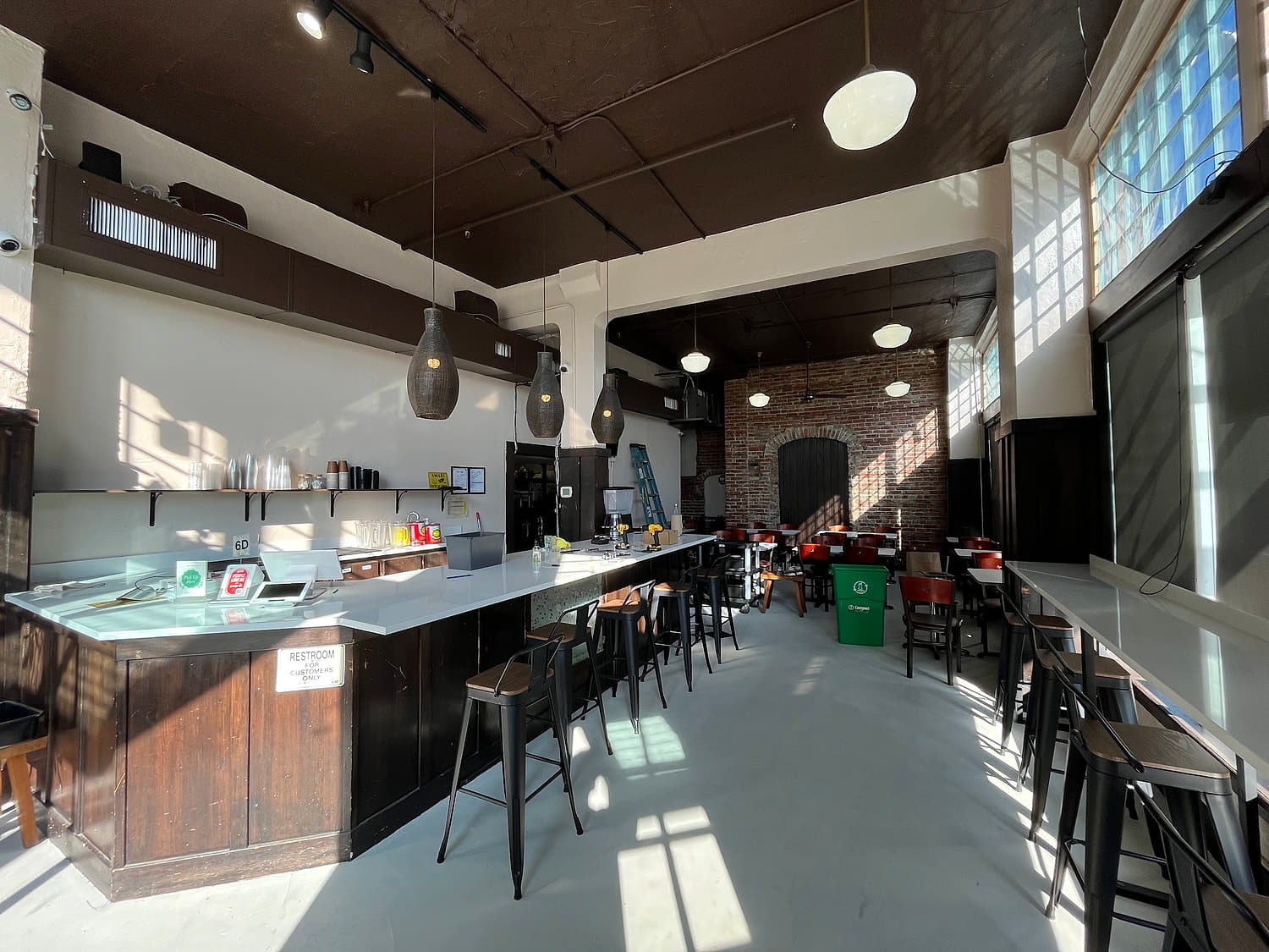 Inside Basil Viet Kitchen on University Way NE — counter seating and daylight